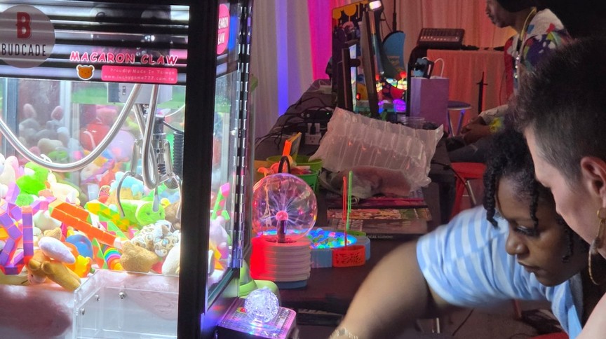Guests at the claw machine at Budcade's Trends LIC launch night