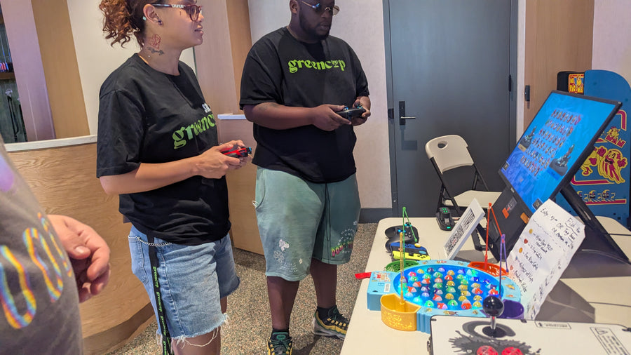 Two guests at the fishing prize game, GreenCup